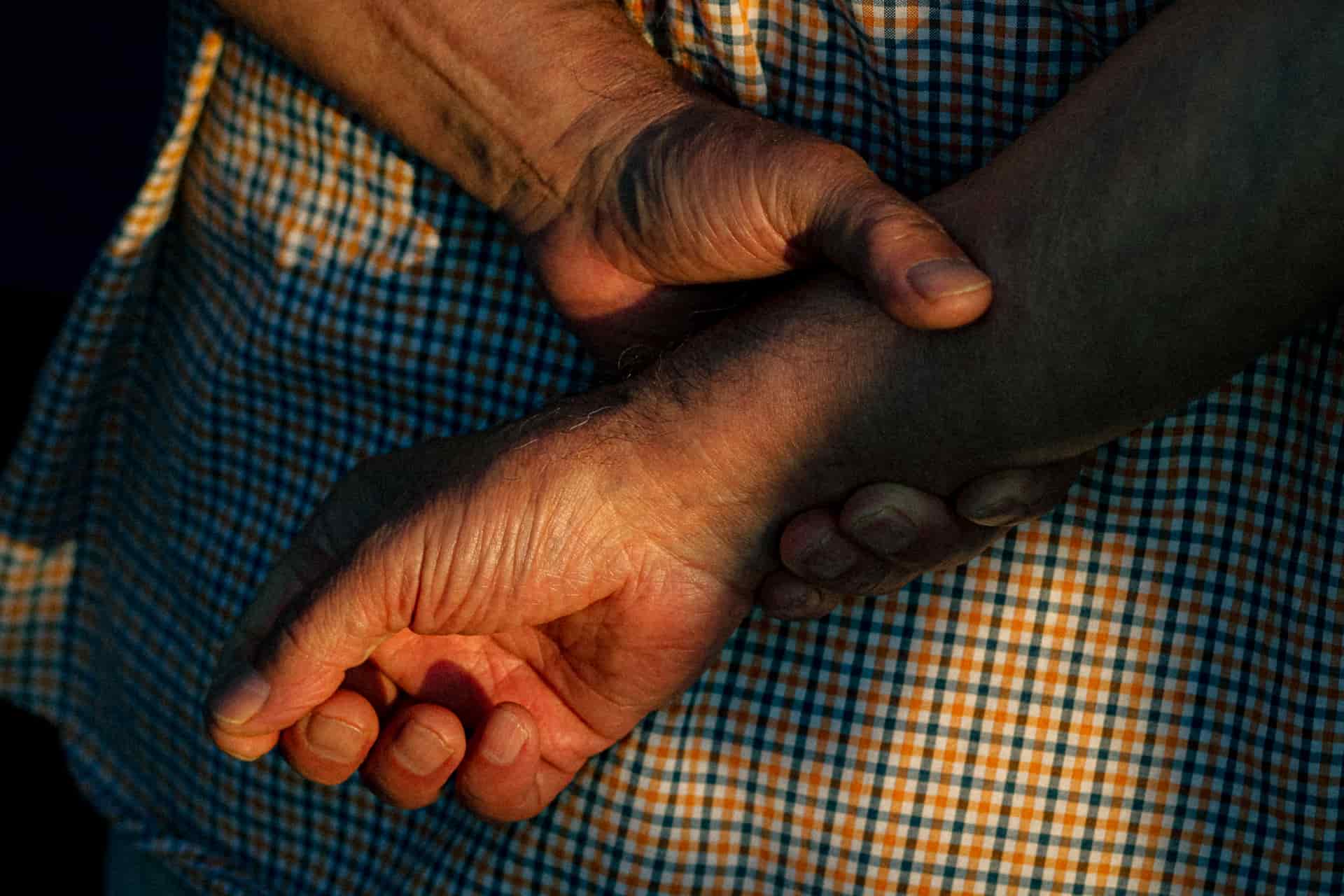 Close-up of a pair of elderly hands resting together
